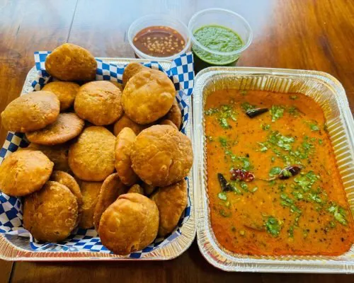 Khasta kachori with tangy curry and chutneys