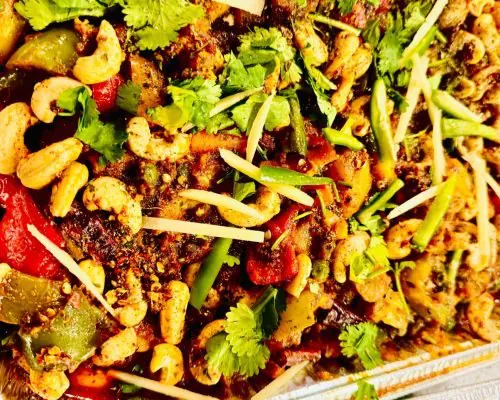 A tray of Cozy Bites mix veg with cashews, peppers and fresh coriander
